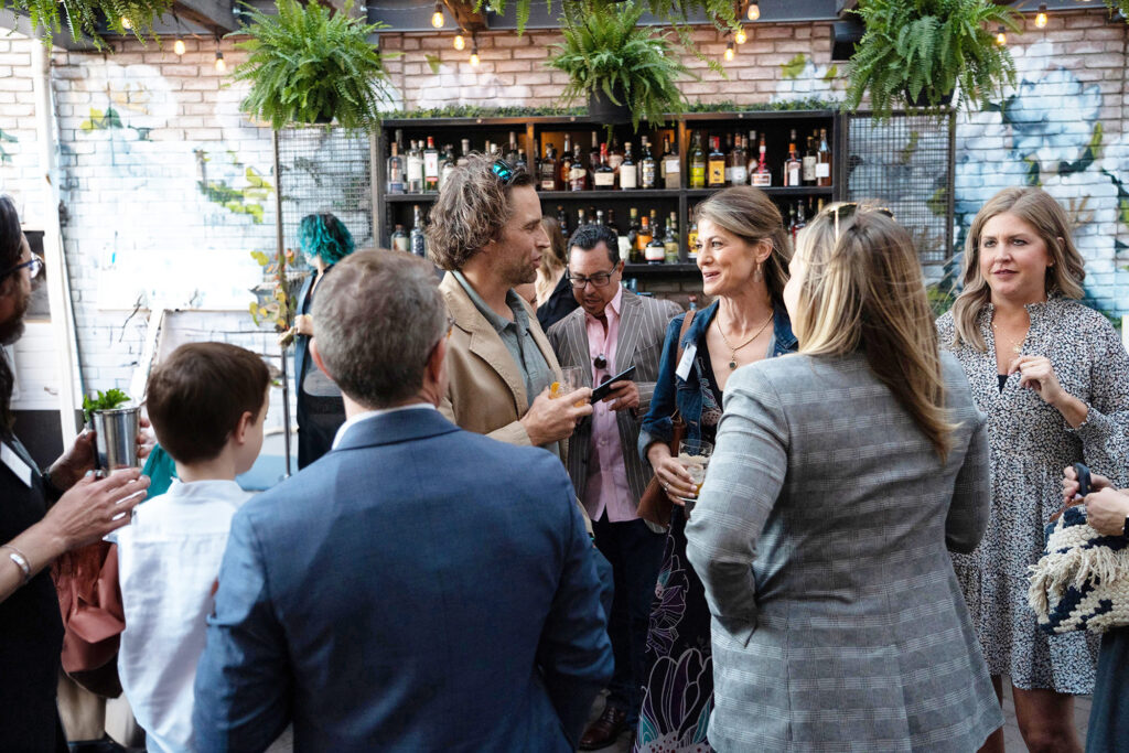 Event photography capturing a group of people engaged in conversation.